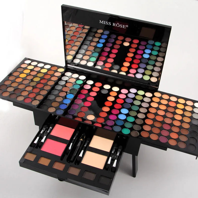 Piano-shaped makeup palette open to show 190 powder pans including eyeshadows, blushes, and face powders