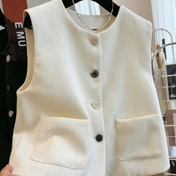 Women's sleeveless bandage vest in milky white with round neckline and fitted silhouette