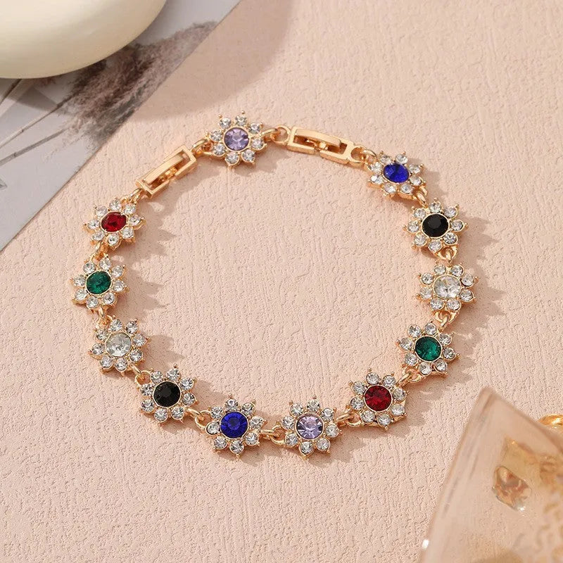 Electroplated zinc alloy flower bracelet with colourful crystal and diamond stones in gold and silver colour finishes