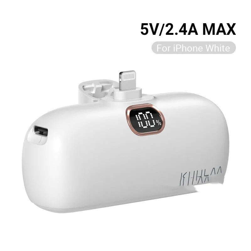 Compact cylindrical alloy power bank with built-in charging cable and LCD digital display.