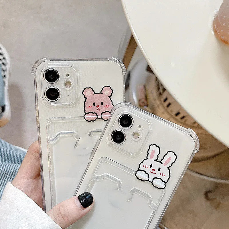 Transparent cartoon graphic iPhone case with integrated card holder slot for Apple models.