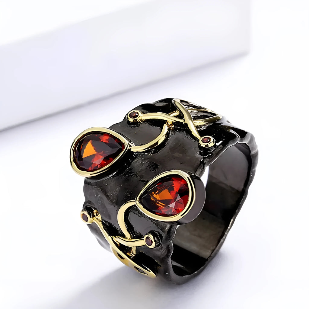Women's black brass straight-pull oval ring on a neutral background