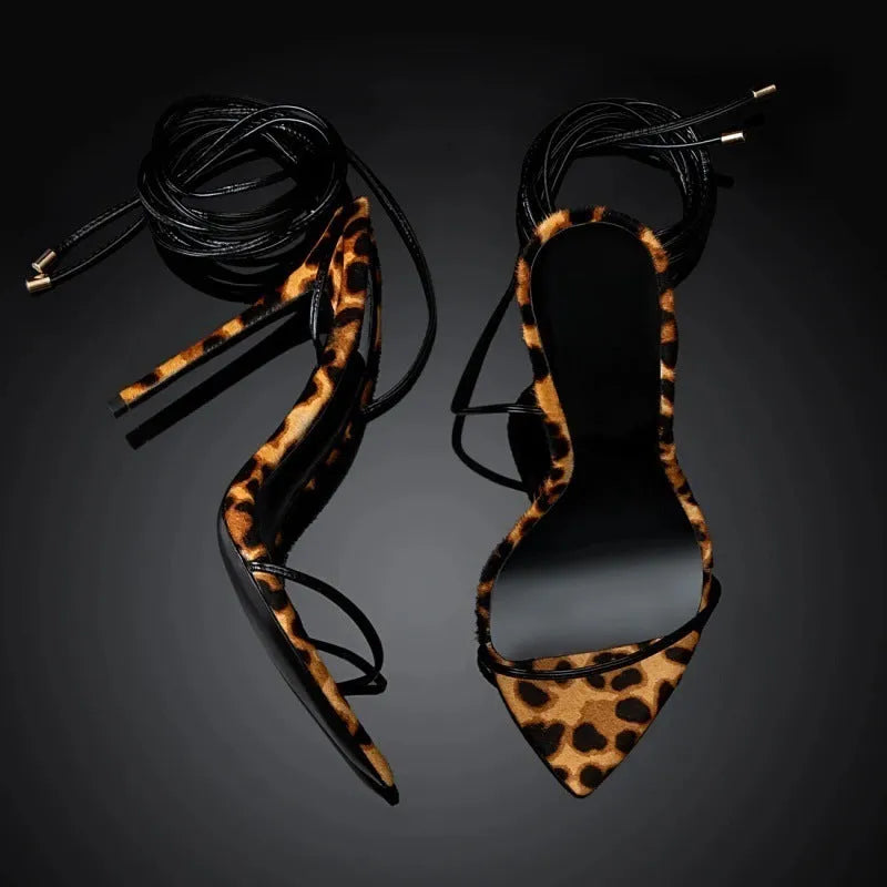 Women's leopard print Roman sandals with pointed toe design and lace-up buckle closure