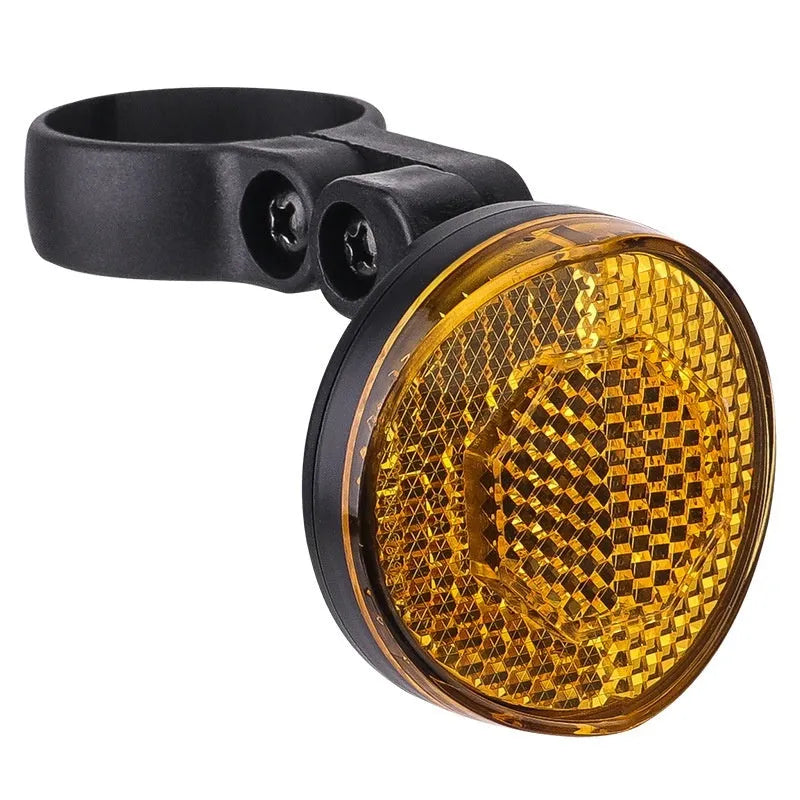 Plastic bicycle taillight with anti-theft bracket mounted on seat post showing red reflective panel