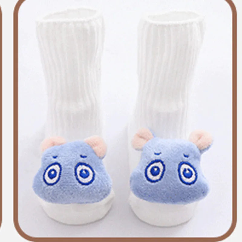 Cotton baby floor socks in assorted colours and prints like blue bow and pink stars on a size chart.