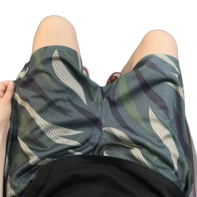 Men's straight-leg camouflage shorts in cotton blend fabric, shown on a size chart.