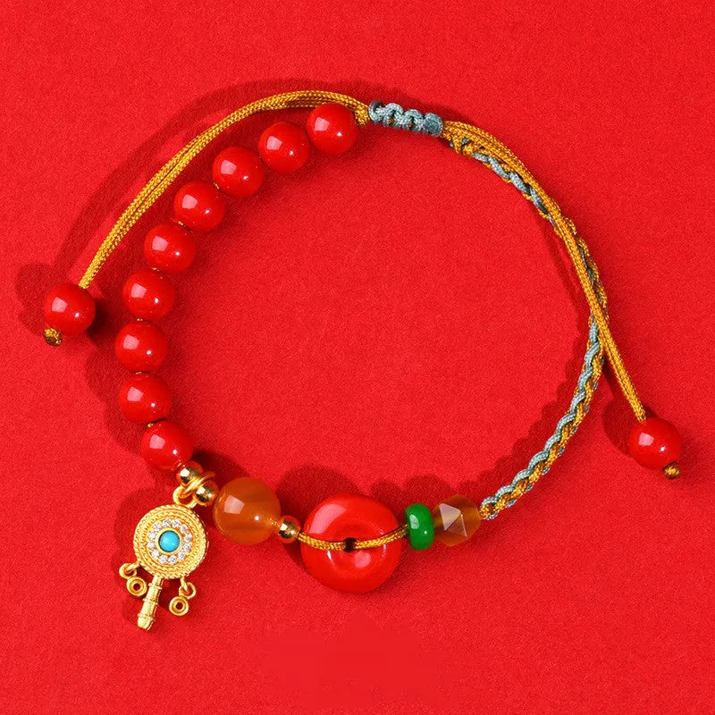 Red cinnabar bracelet with geometric patterns and peace buckle closure
