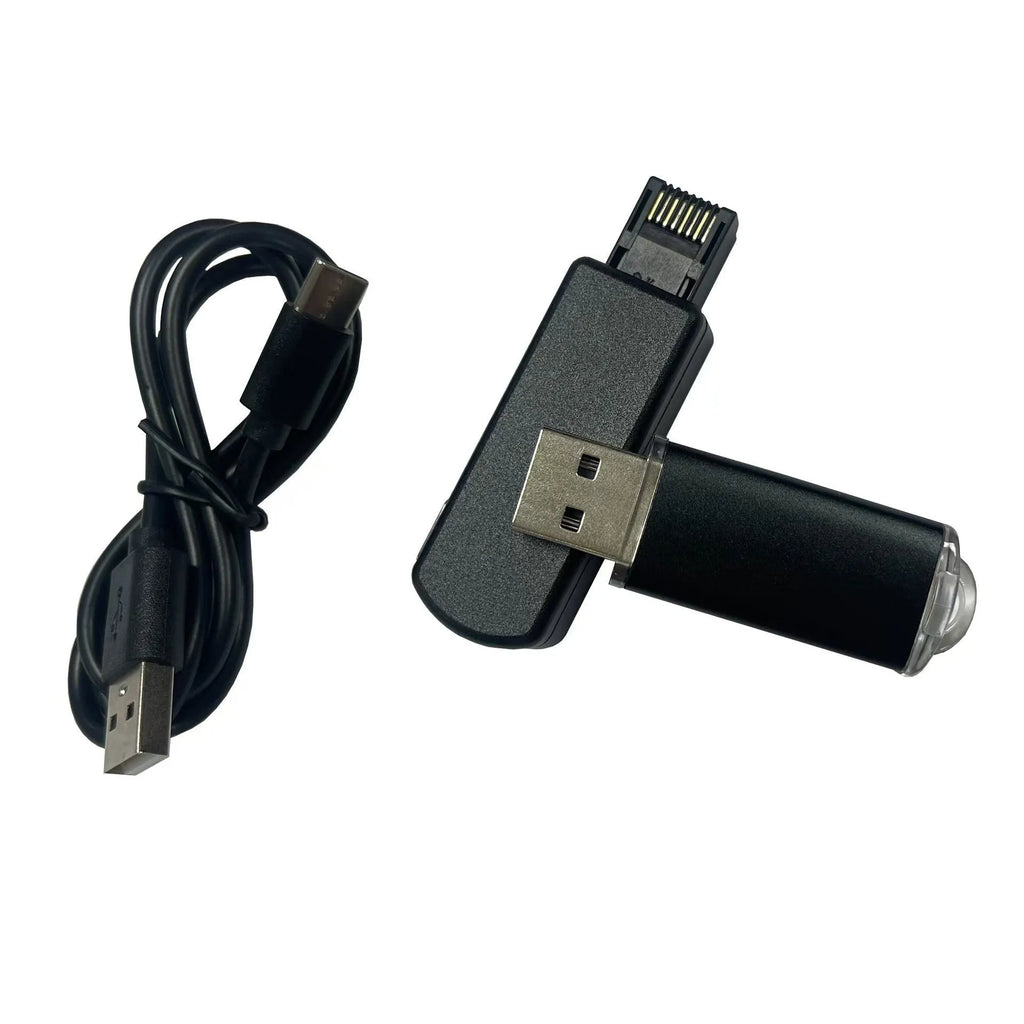 Black JB Tool USB adapter with Ethernet port for PlayStation consoles on a grey background.