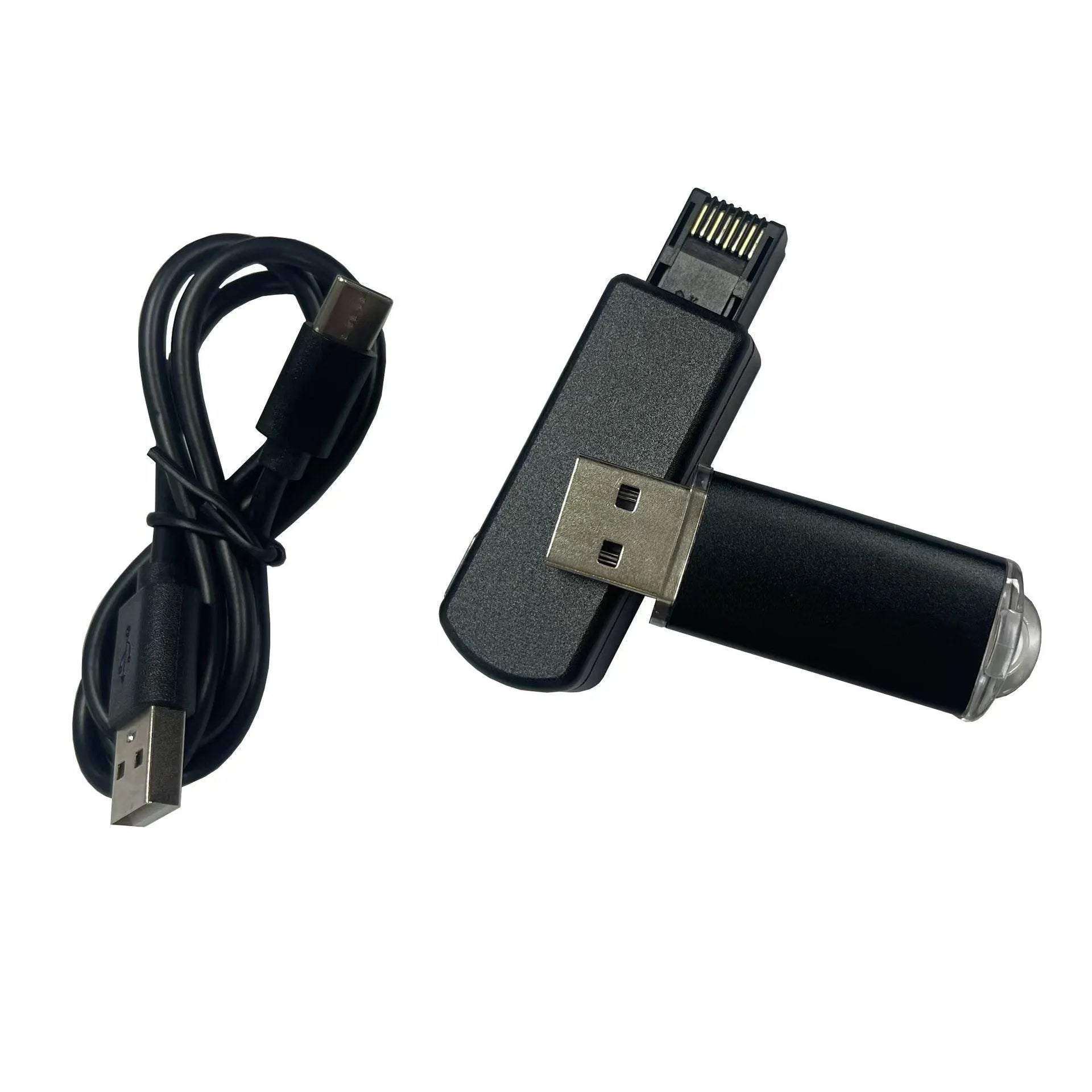 Black JB Tool USB adapter with Ethernet port for PlayStation consoles on a grey background.