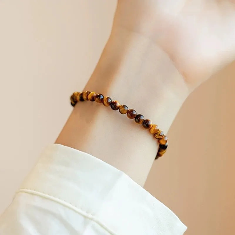 Handmade new Chinese style tigereye geometric round bead bracelet showing natural banding patterns