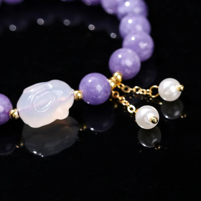 Purple aquamarine chalcedony and agate rabbit bracelet with geometric beads sized 6mm, 8mm, and 12 by 16mm.