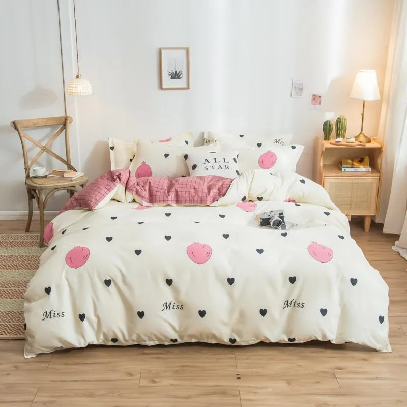 Cotton duvet cover and fitted sheet bedding set in a colour option, shown on a bed