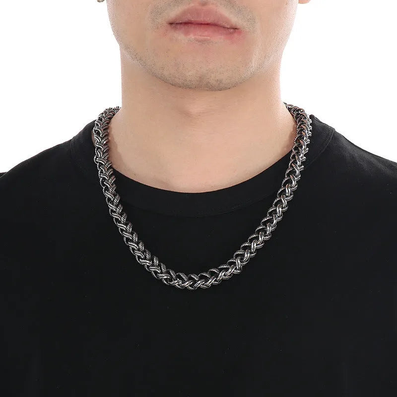 Men's keel twist titanium steel chain necklace in antique silver on a grey background