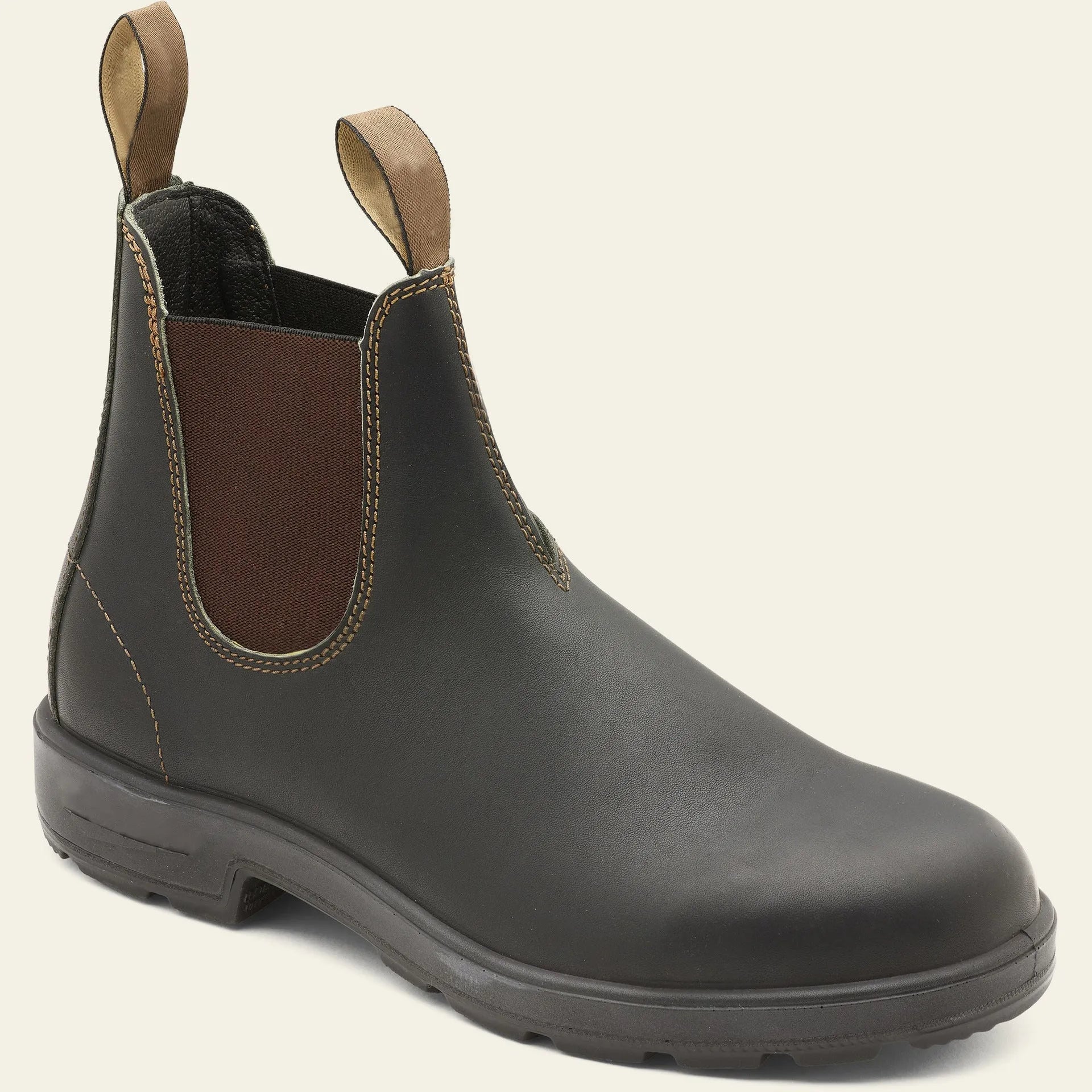 Vintage grey unisex Chelsea boots on a wooden floor, showing frosted PU upper, round toe, low heel, and car stitch detail.