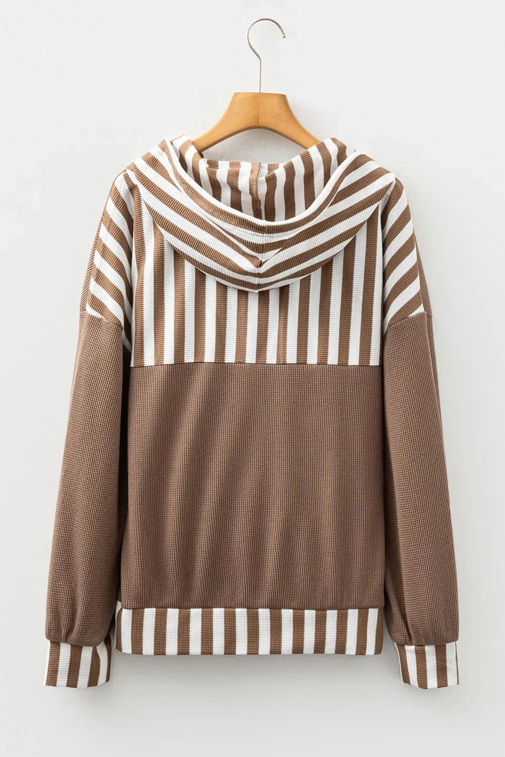 Straw yellow hoodie with waffle texture, striped patchwork, a button neck, and a drawstring hood.