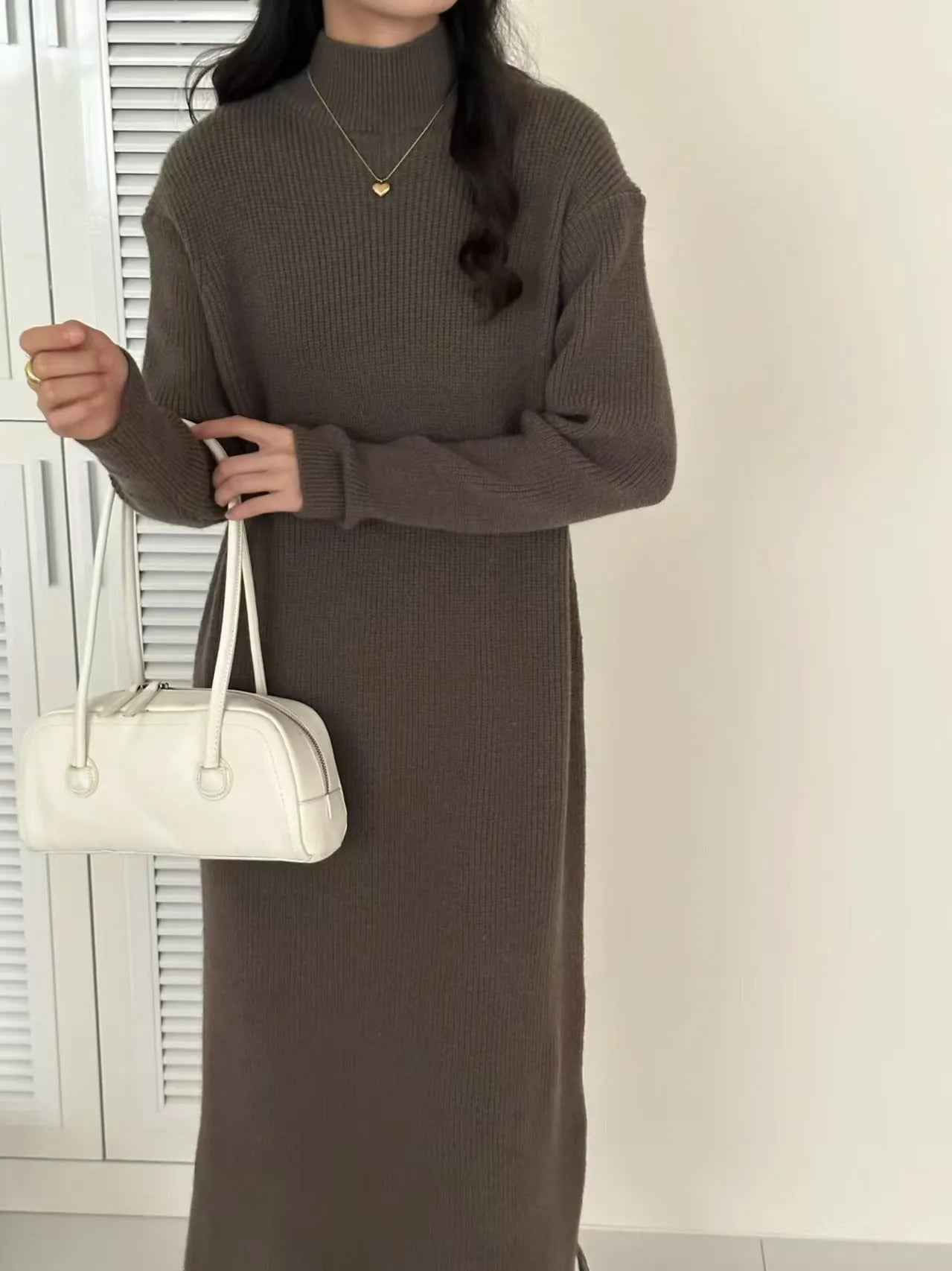 Acrylic half turtleneck knee-length knit dress in khaki colour with long sleeves.
