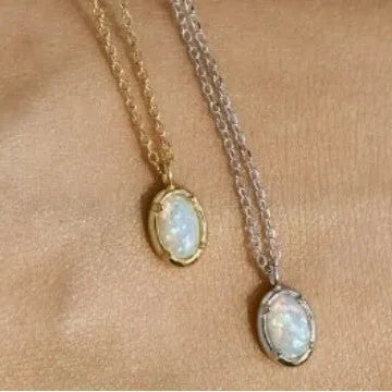 Oval jelly opal geometric pendant on a sterling silver chain with gold plating.