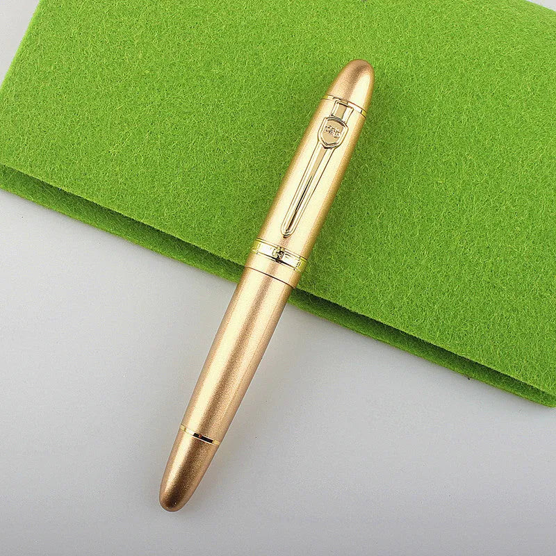 Metal ball pen with pearl beads, black body and silver clip, lying on a desk