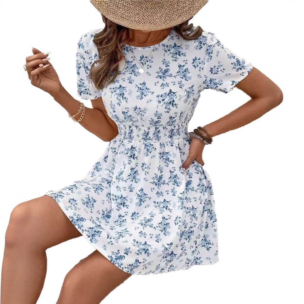 Light blue A-line midi dress with high waist and regular sleeves on a model.