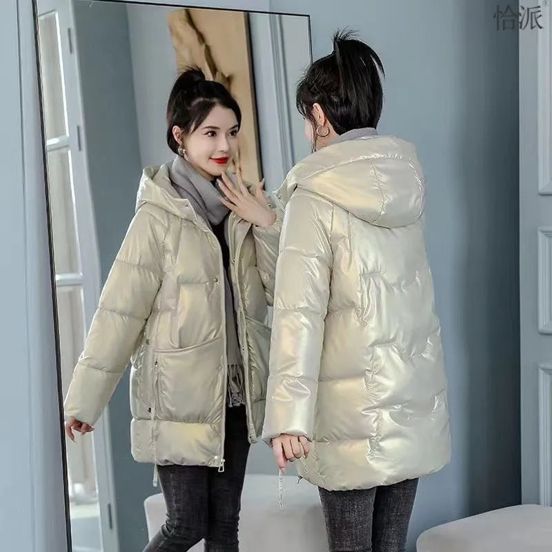 Women's loose-fitting long sleeve hooded jacket in black, shown on a hanger.