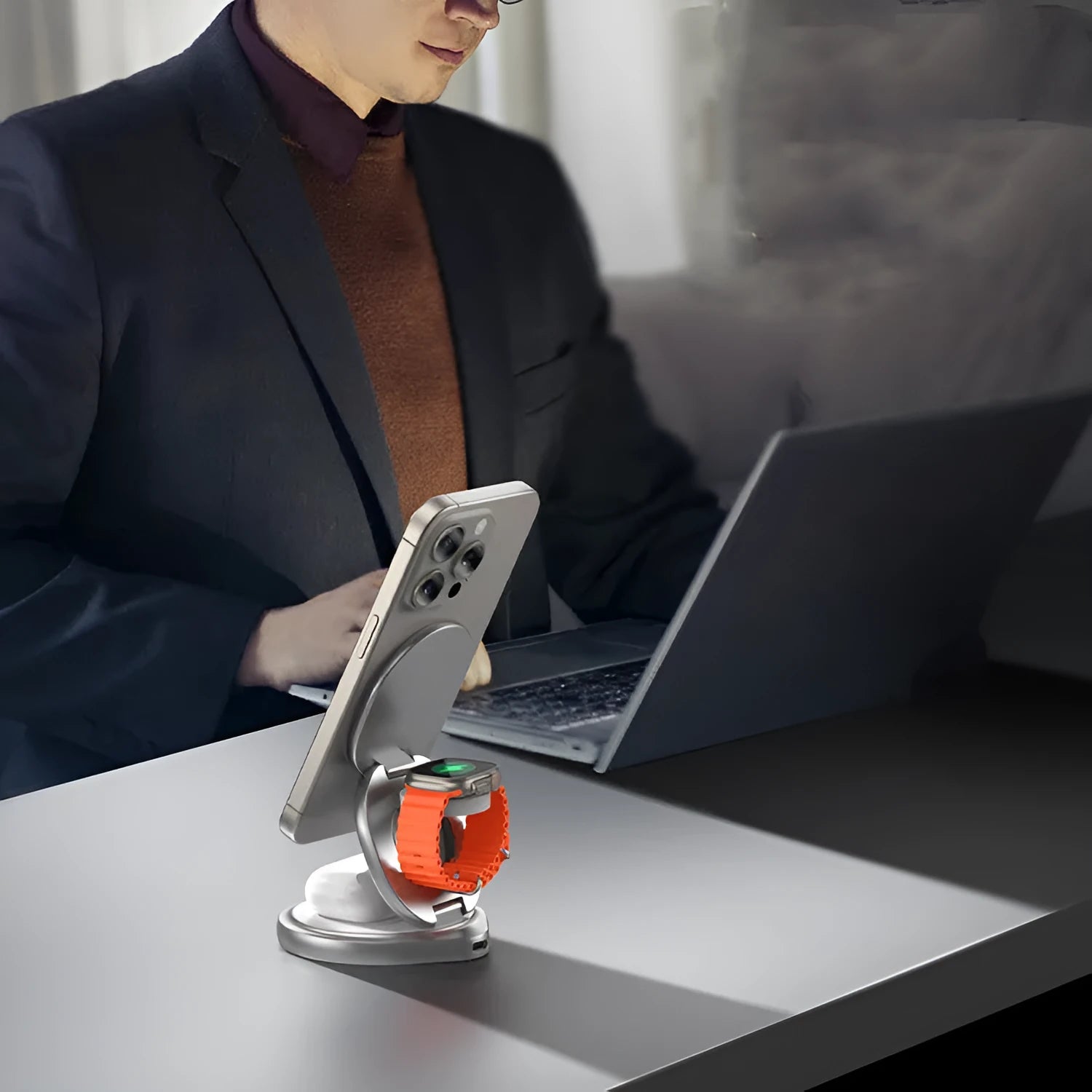 3-in-1 magnetic folding wireless charger stand in grey, with phone and headphones on a desk