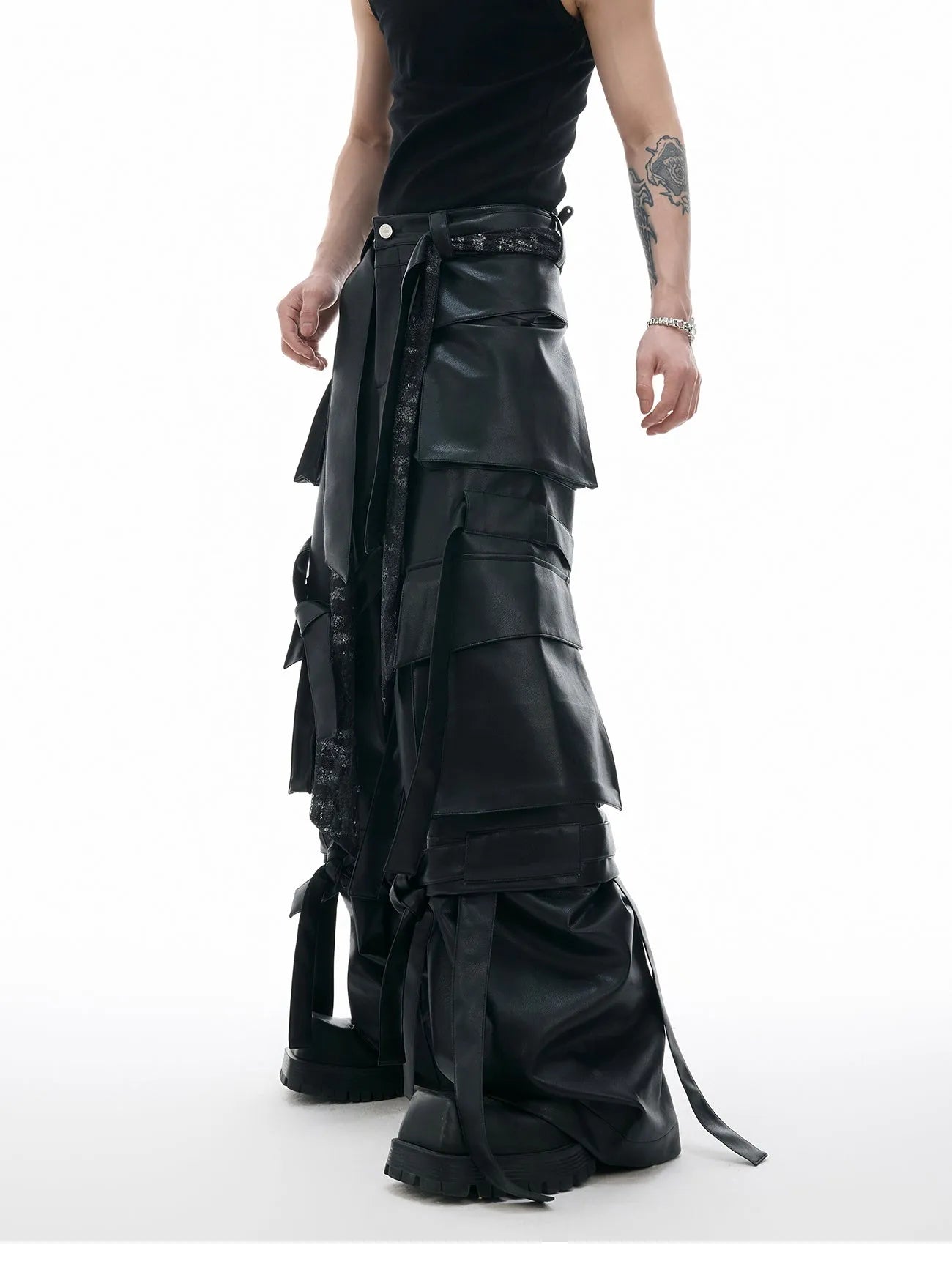 Black loose-fit quilted trousers with multiple pockets on a mannequin.