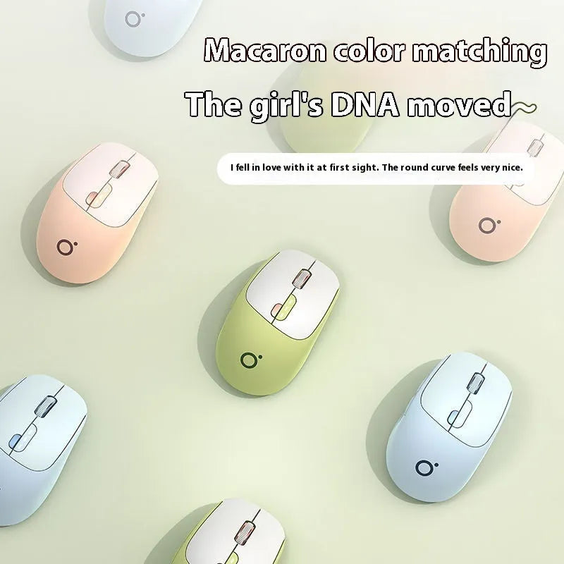 Mute wireless Bluetooth and 2.4GHz computer mouse in Matcha Green colour on a wooden desk