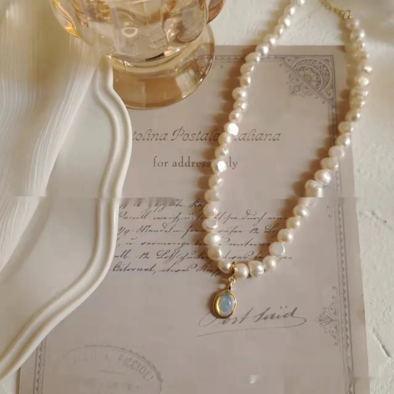 Geometric-shaped alloy necklace on a model, showing its adjustable chain length.