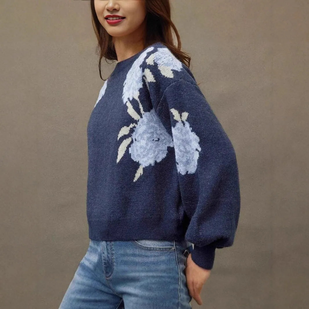 Sapphire blue women's pullover with a loose fit and an all-over floral jacquard pattern.