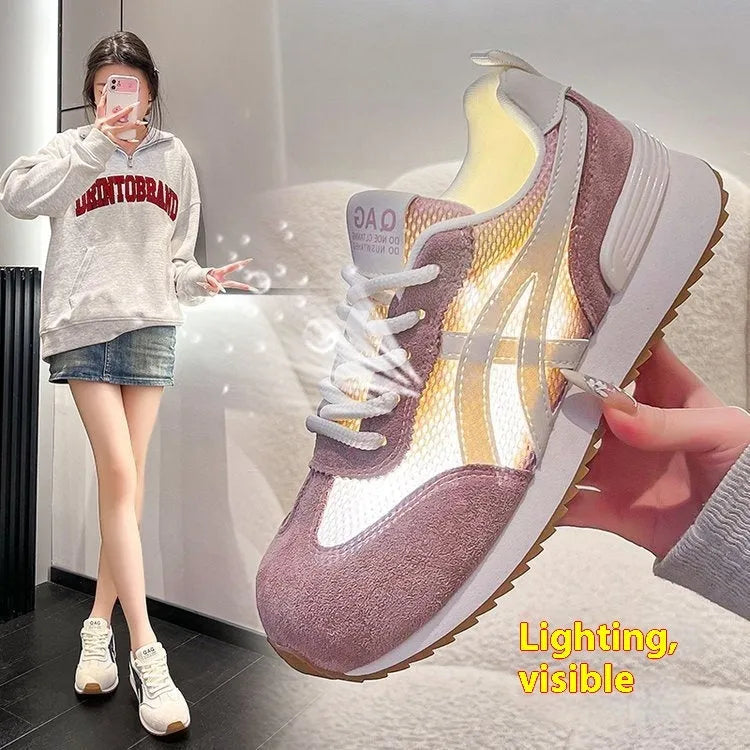 Women's white lace-up casual sneaker with round toe and flat heel on a non-slip sole.