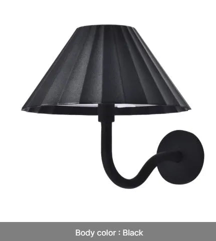 Alloy desk lamp with black finish, warm LED light, and touch dimming switch on a desk