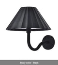 Alloy desk lamp with black finish, warm LED light, and touch dimming switch on a desk