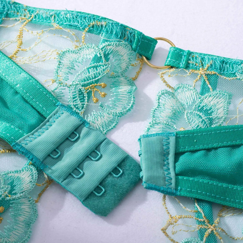 Light green women's bra set with embroidery detailing and matching bikini bottoms.