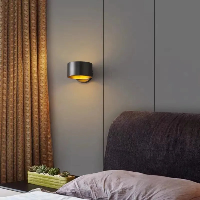 Modern simple style copper wall lamp in black or gold finish with plug.
