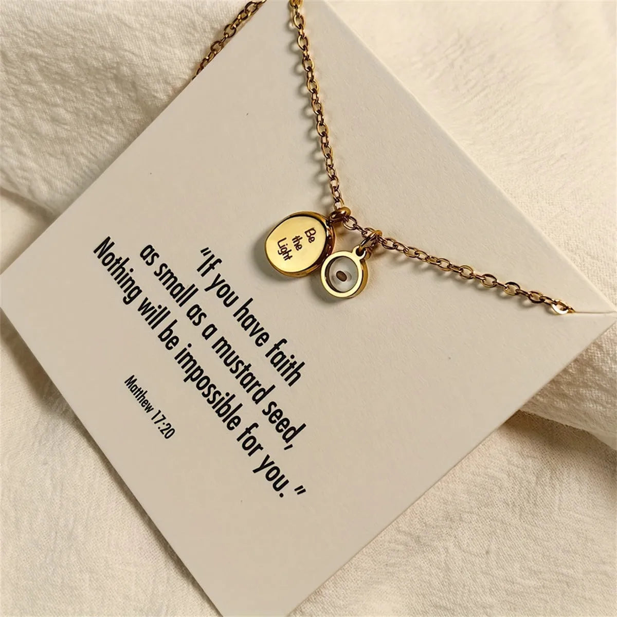 Stainless steel mustard seed faith pendant necklace on adjustable chain, silver colour, geometric shape with drip oil finish
