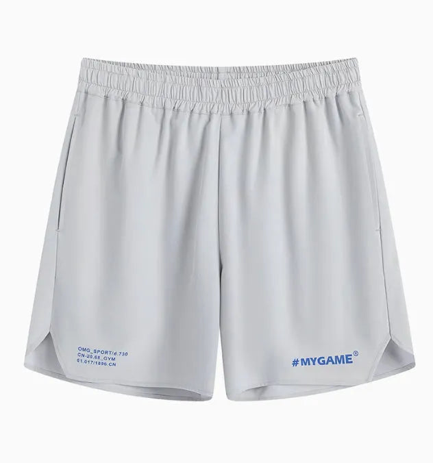 Men's grey high elasticity fitness training shorts on a gym floor.