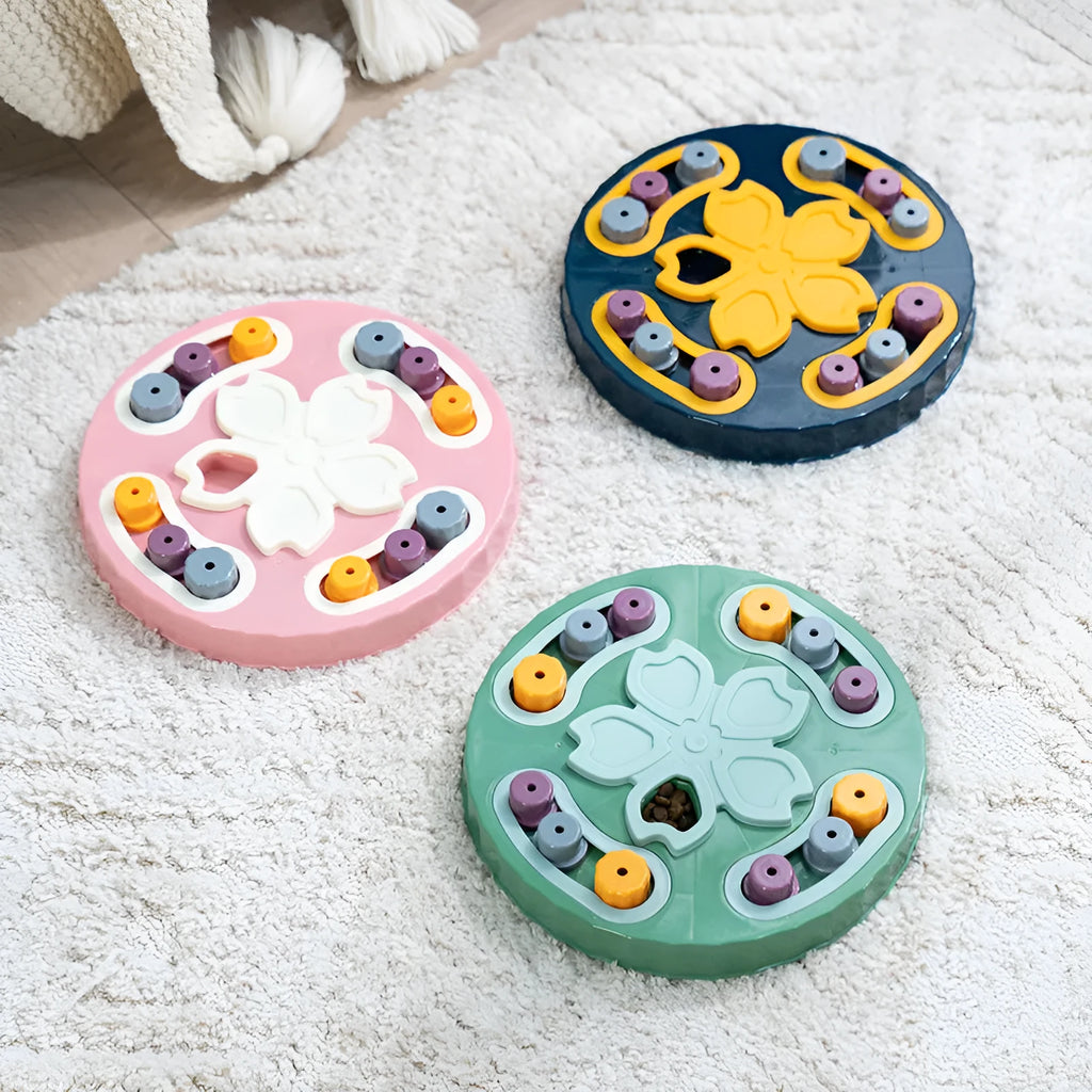 Interactive dog slow feeder puzzle toy in blue, green, and pink colour options.