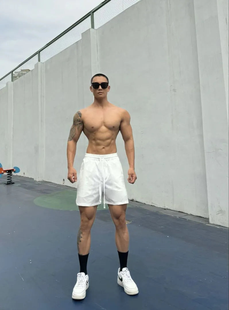 Men's ice silk quick-drying double-layer casual shorts in various colours on a size chart.