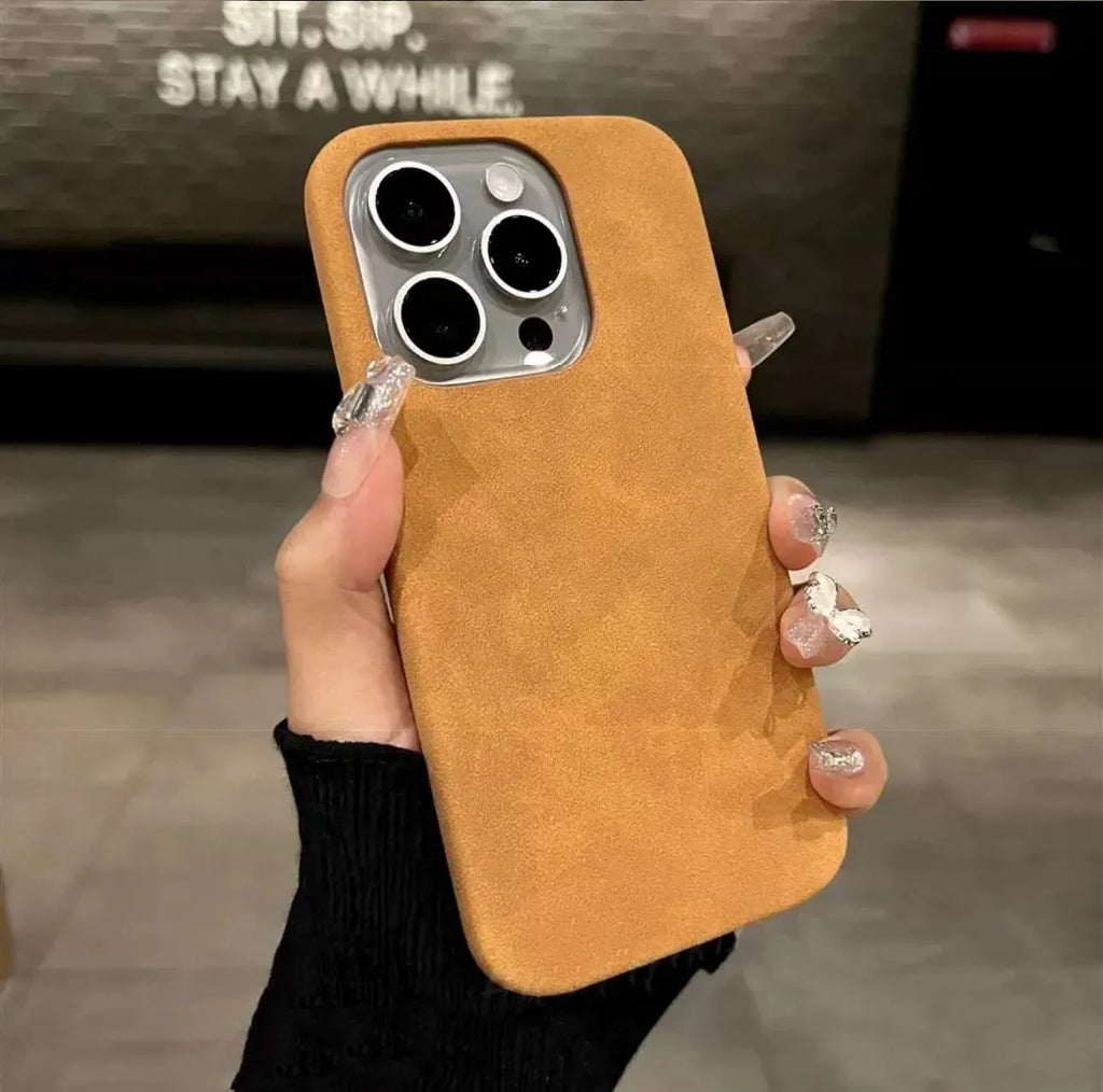 Solid colour suede iPhone case with frosted finish in dark green, shown on an iPhone