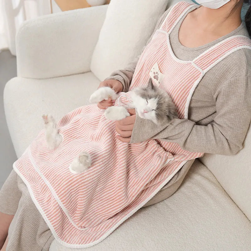 Cloth cat petting apron in a striped pattern, shown worn by a person holding a cat.