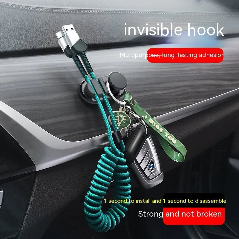 Car data cable storage hook in dark green with adhesive mount for vehicle organisation