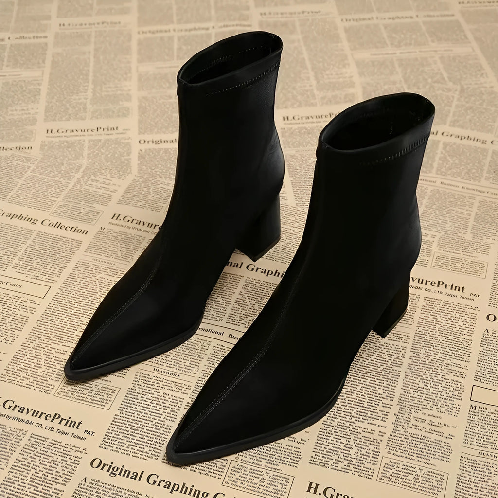 Women's khaki stretch artificial velboa ankle boots with a wedge heel and pointed toe on a plain background.