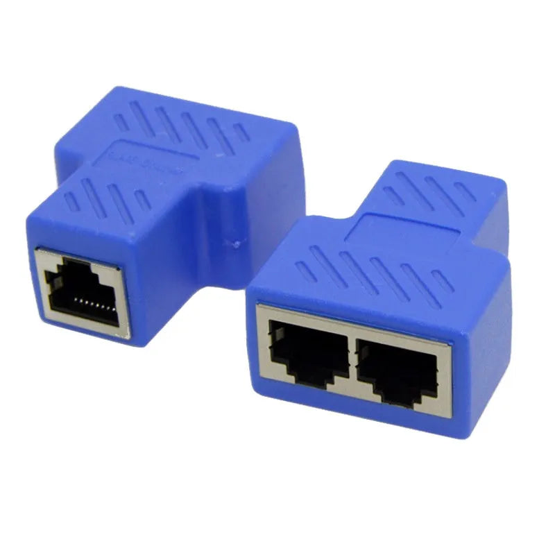 Two white RJ45 three-way tee network cable splitters on a dark surface.