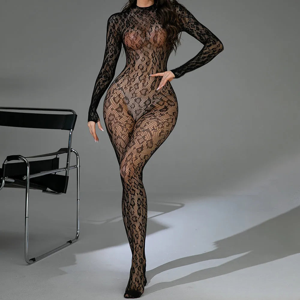 Black long sleeve backless fishnet lingerie bodysuit with jacquard detail laid flat.