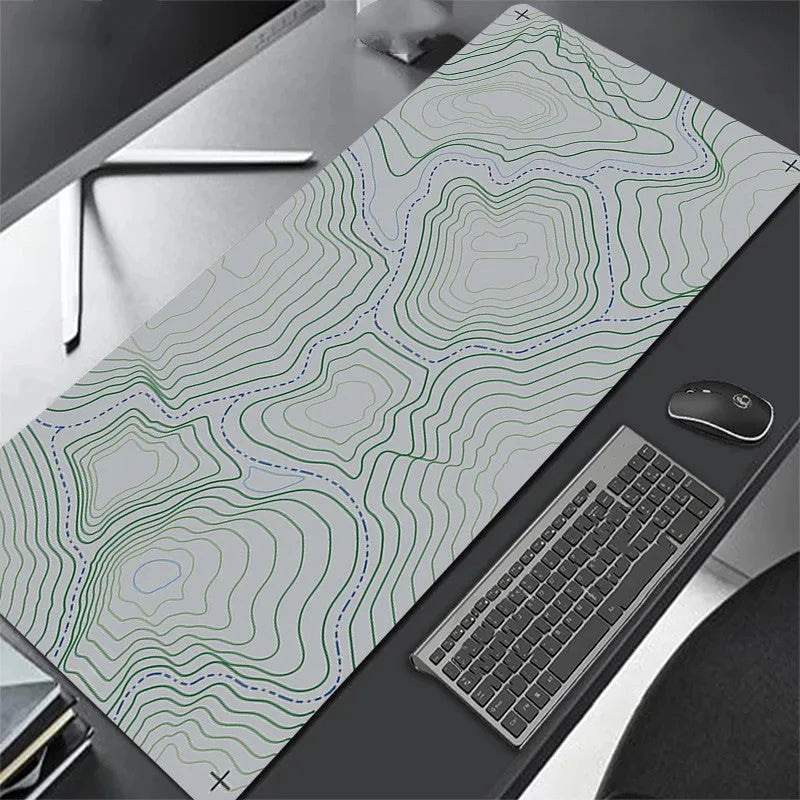 All black extra long mouse pad with precision overlock stitching on a desk