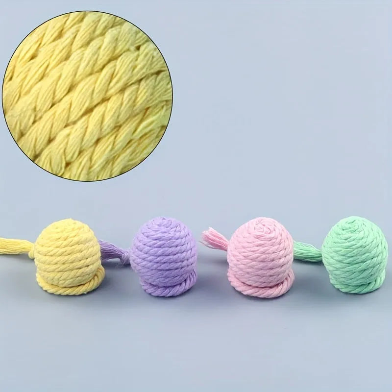 Colourful cat toy ball with rope attachment and built-in bell for interactive pet play