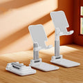 Folding telescopic mobile phone bracket in white colour with extended arms