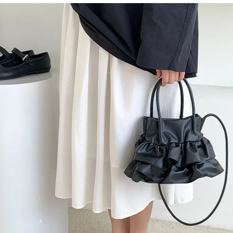 Bucket style PU folding shoulder bag in beige with open pocket for daily commute