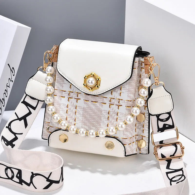 Women's crossbody phone bag in PU leather with pearl pendant and gold metal studs, magnetic flap closure