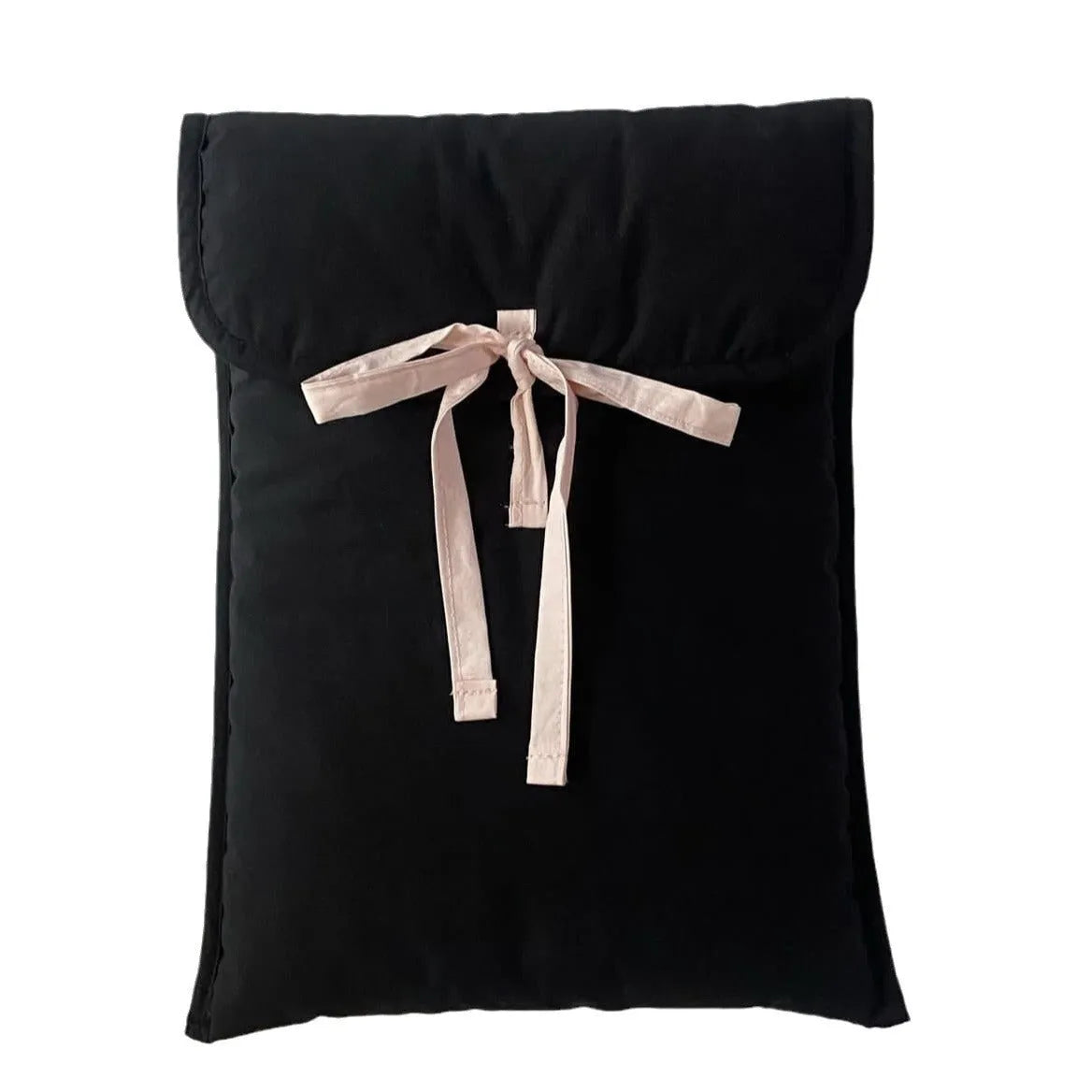 Black and white women's quilted nylon laptop bag with a ballet-style bow.